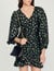 Short gathered dress with a floral print