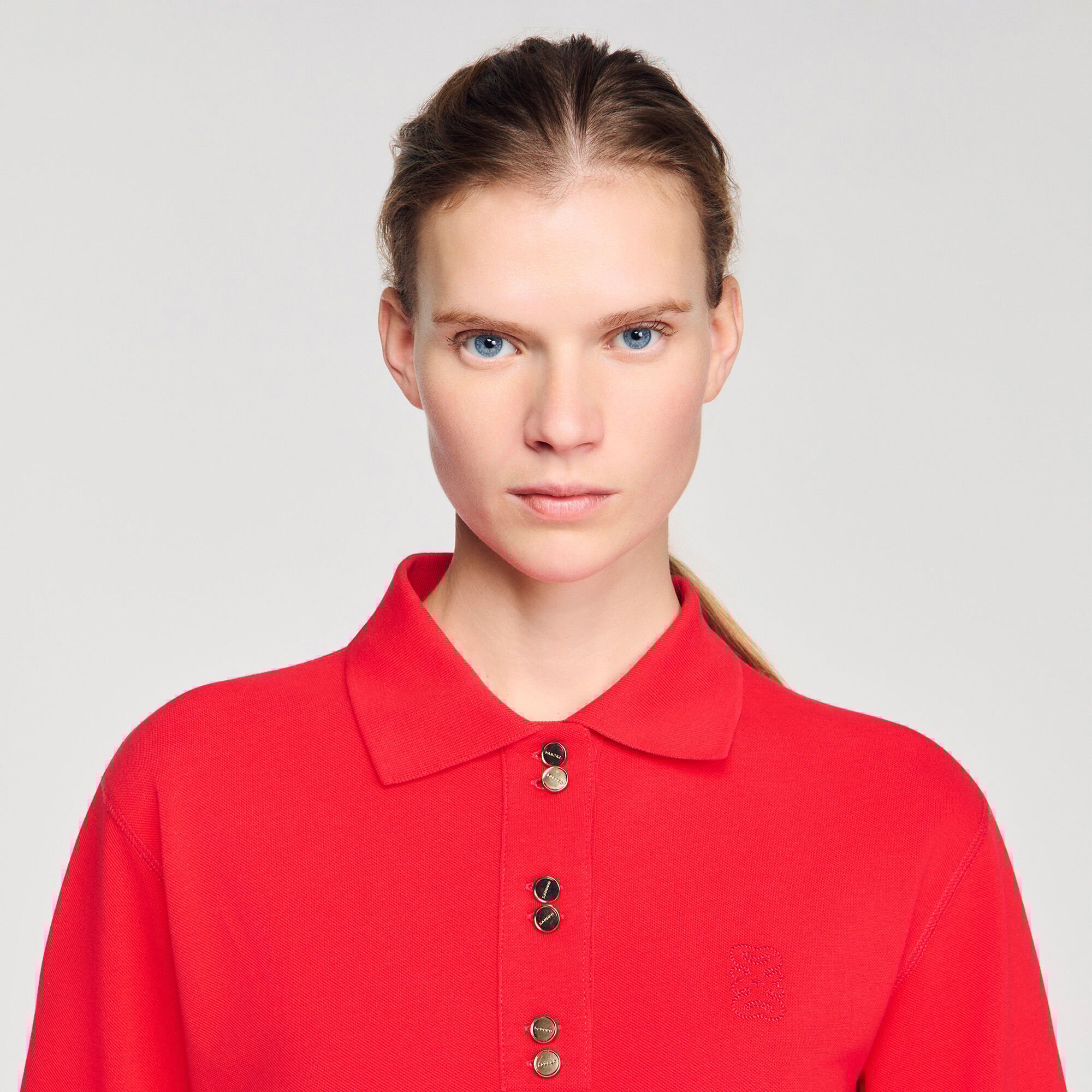 Polo shirt with decorative buttons