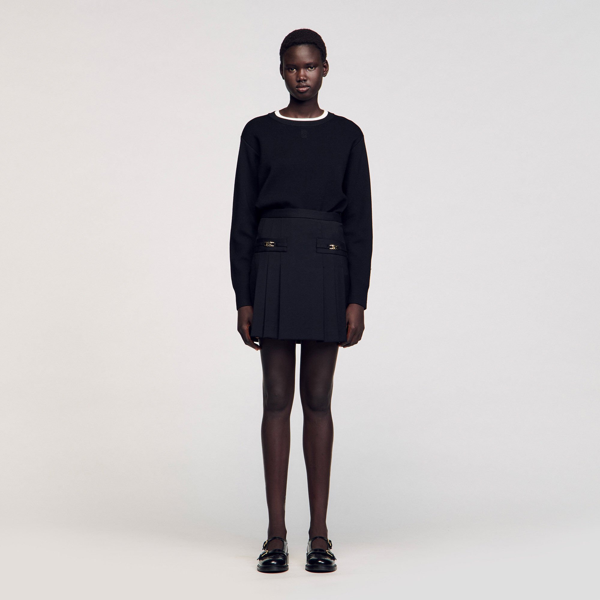 Short skirt with stitched pleats