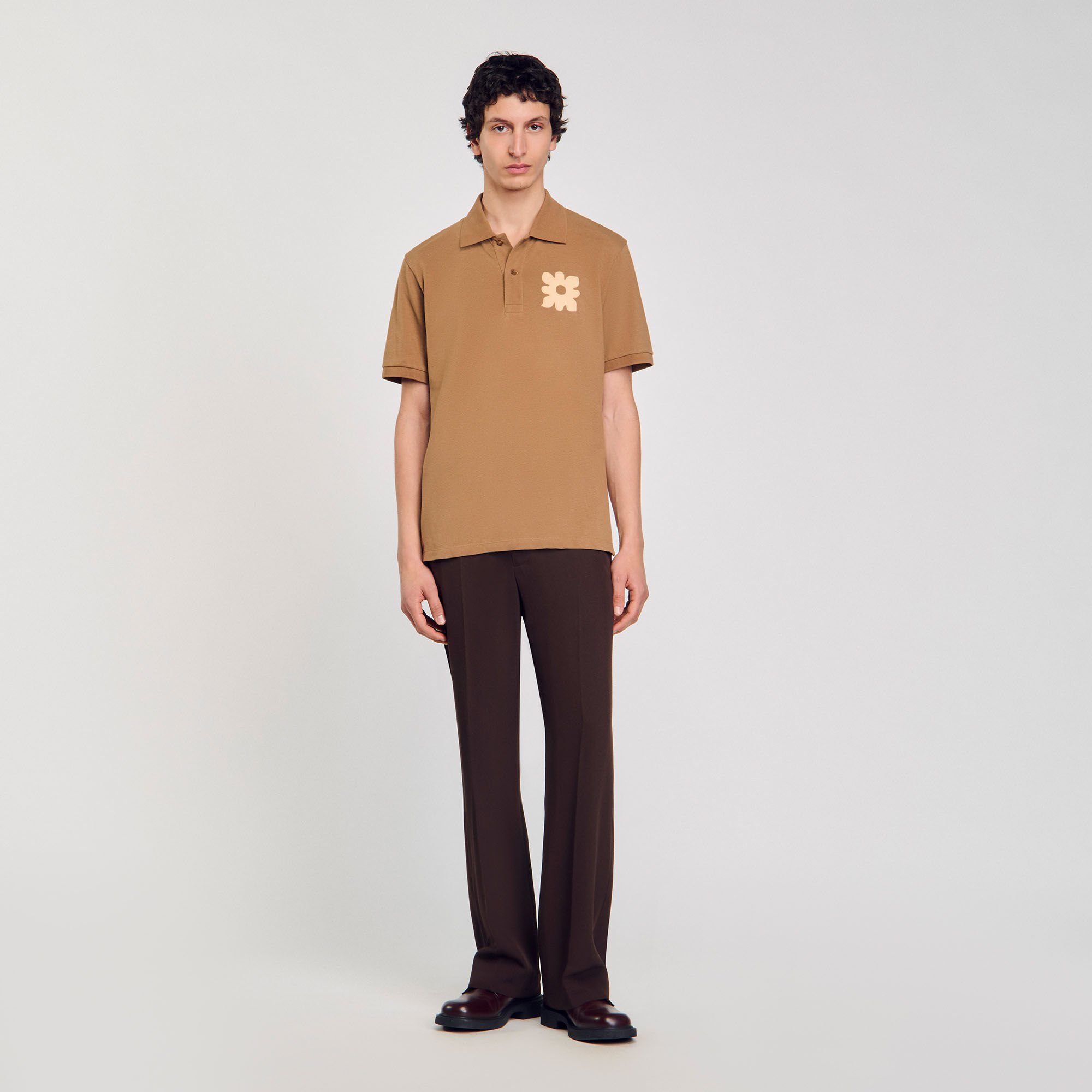 Polo shirt with flower patch