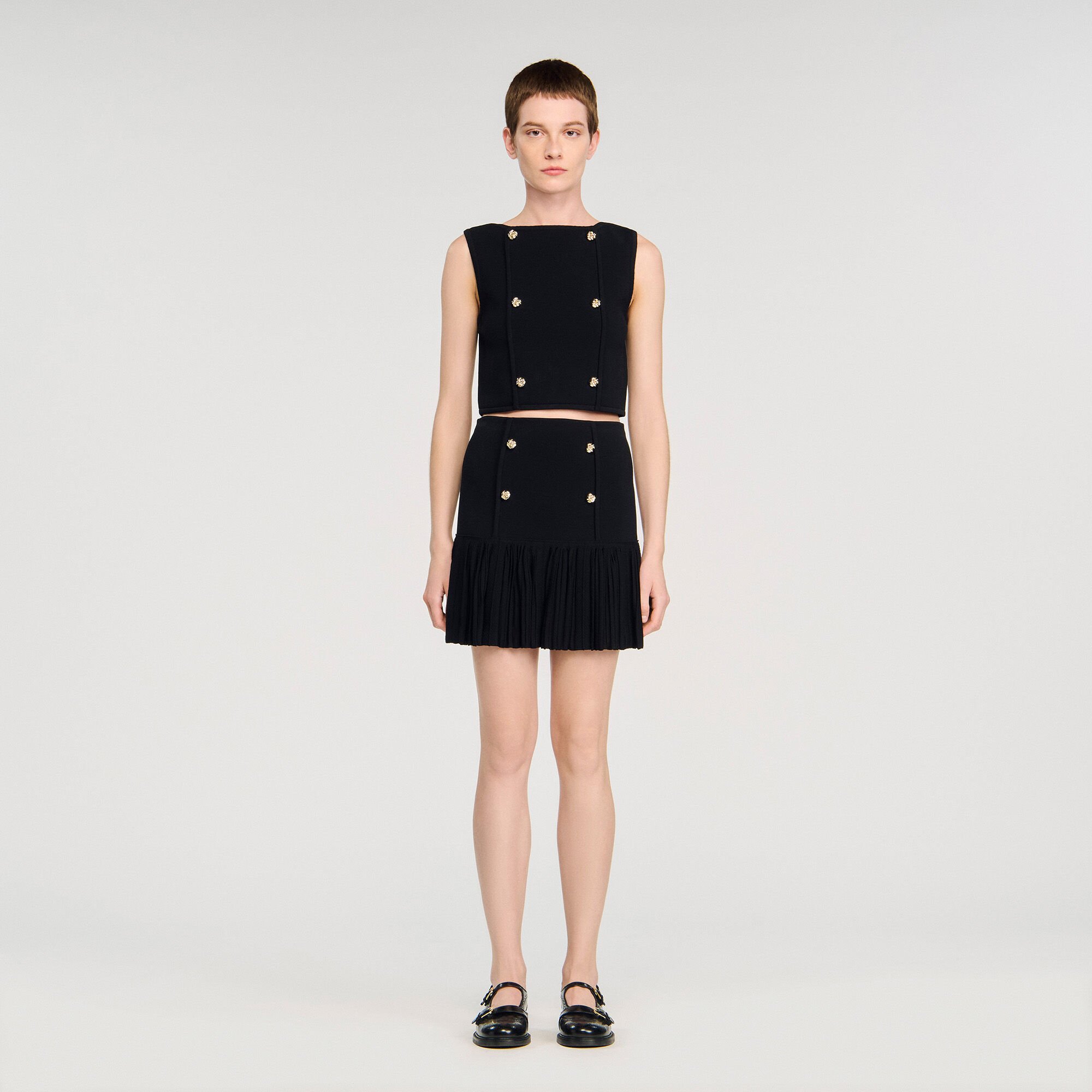 Short pleated knit skirt