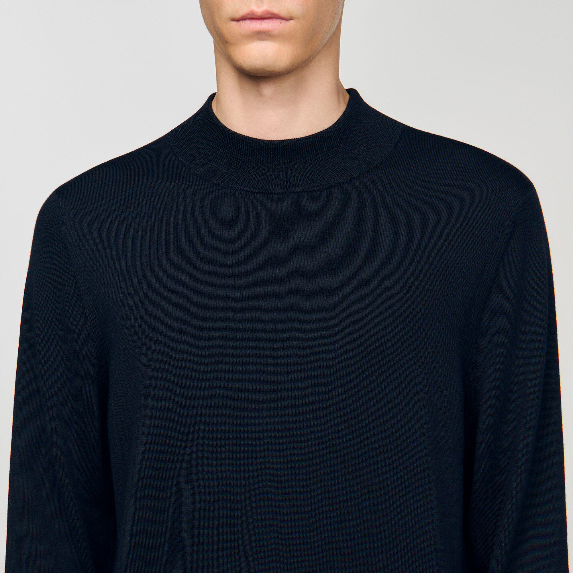 Wool jumper with a high collar