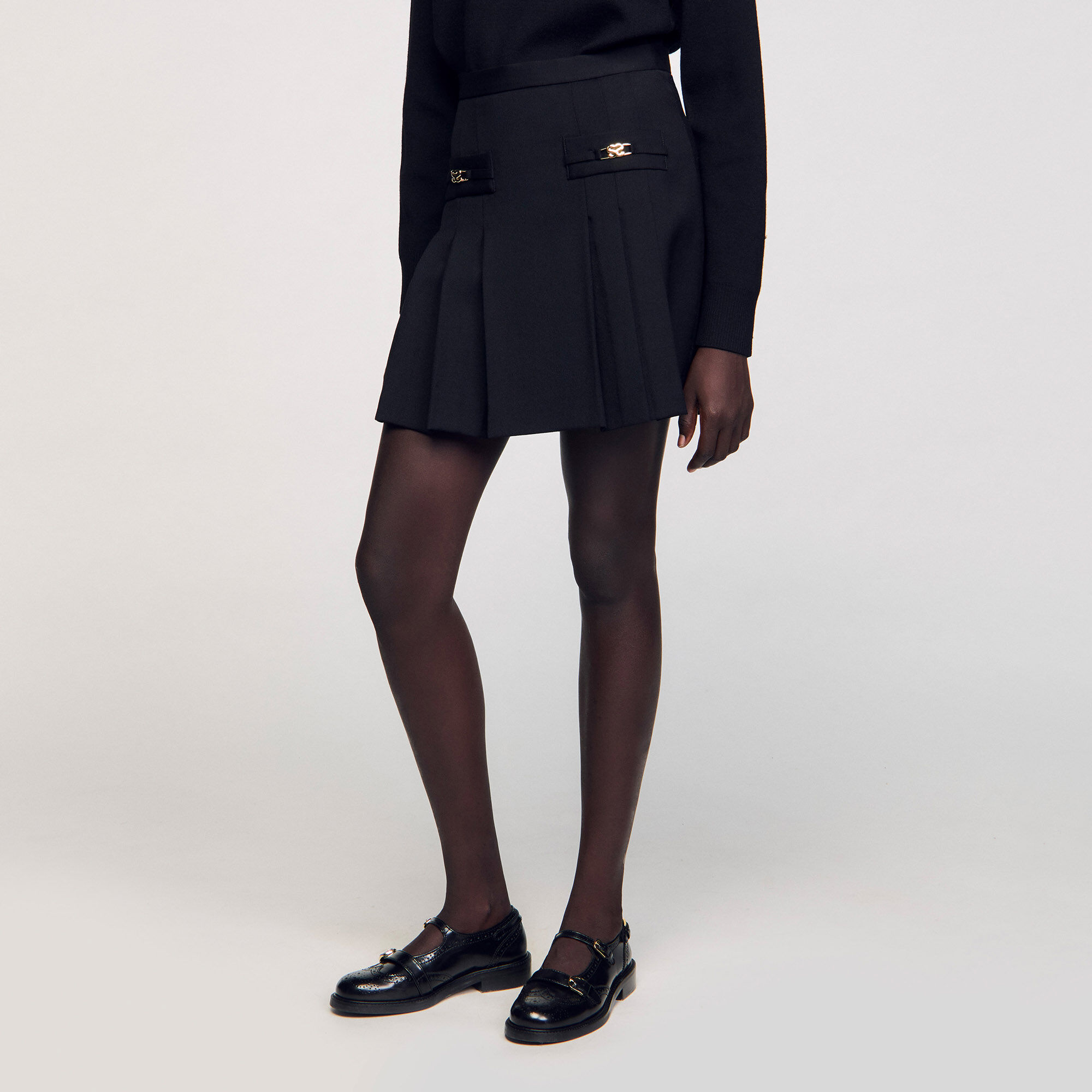 Short skirt with stitched pleats