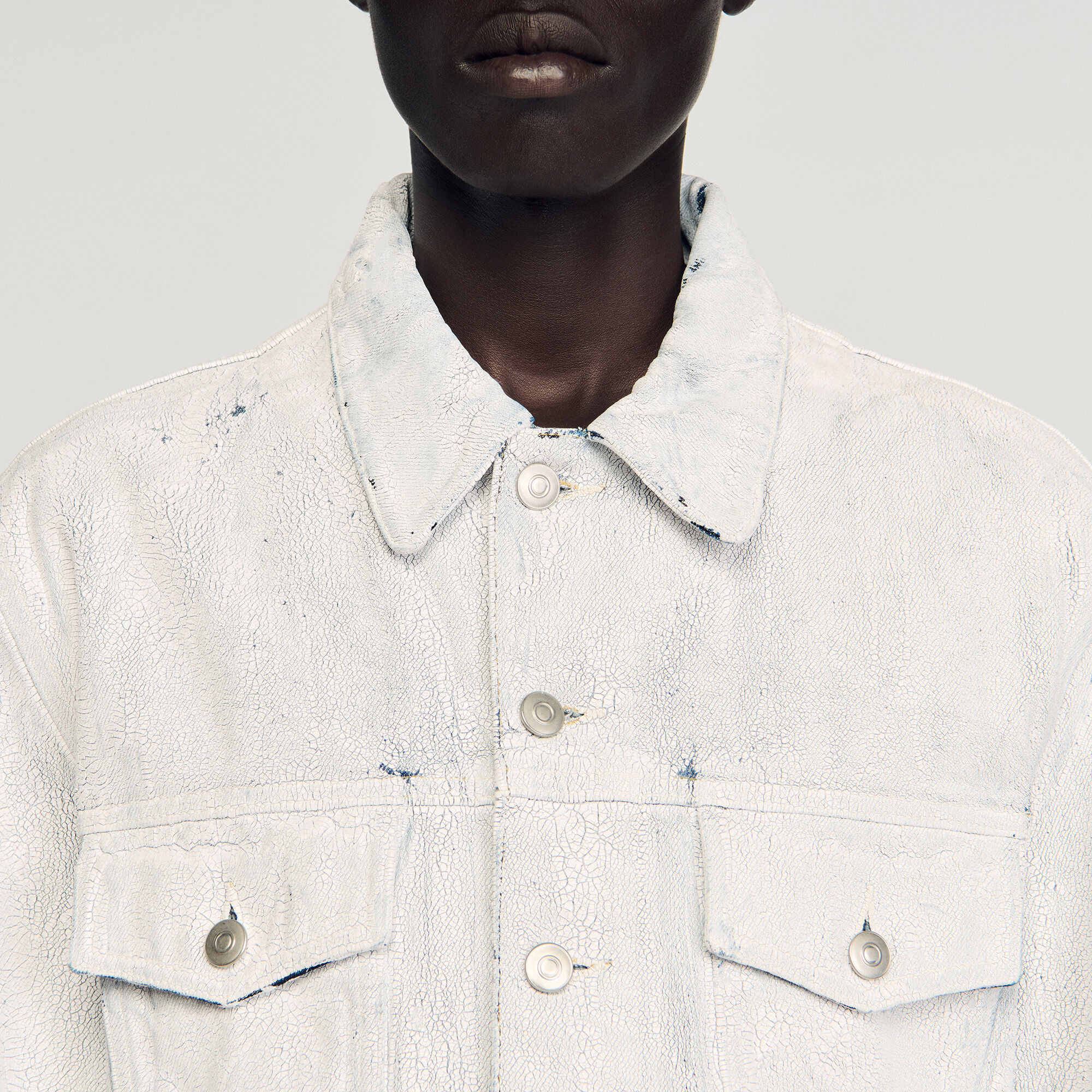 Cracked coated denim jacket