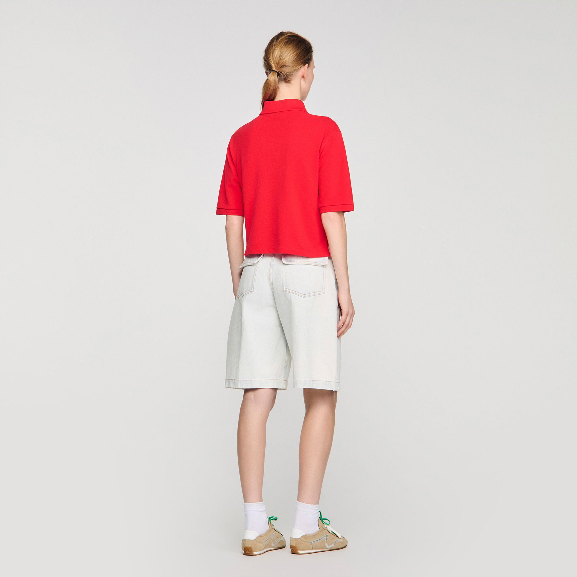 Polo shirt with decorative buttons