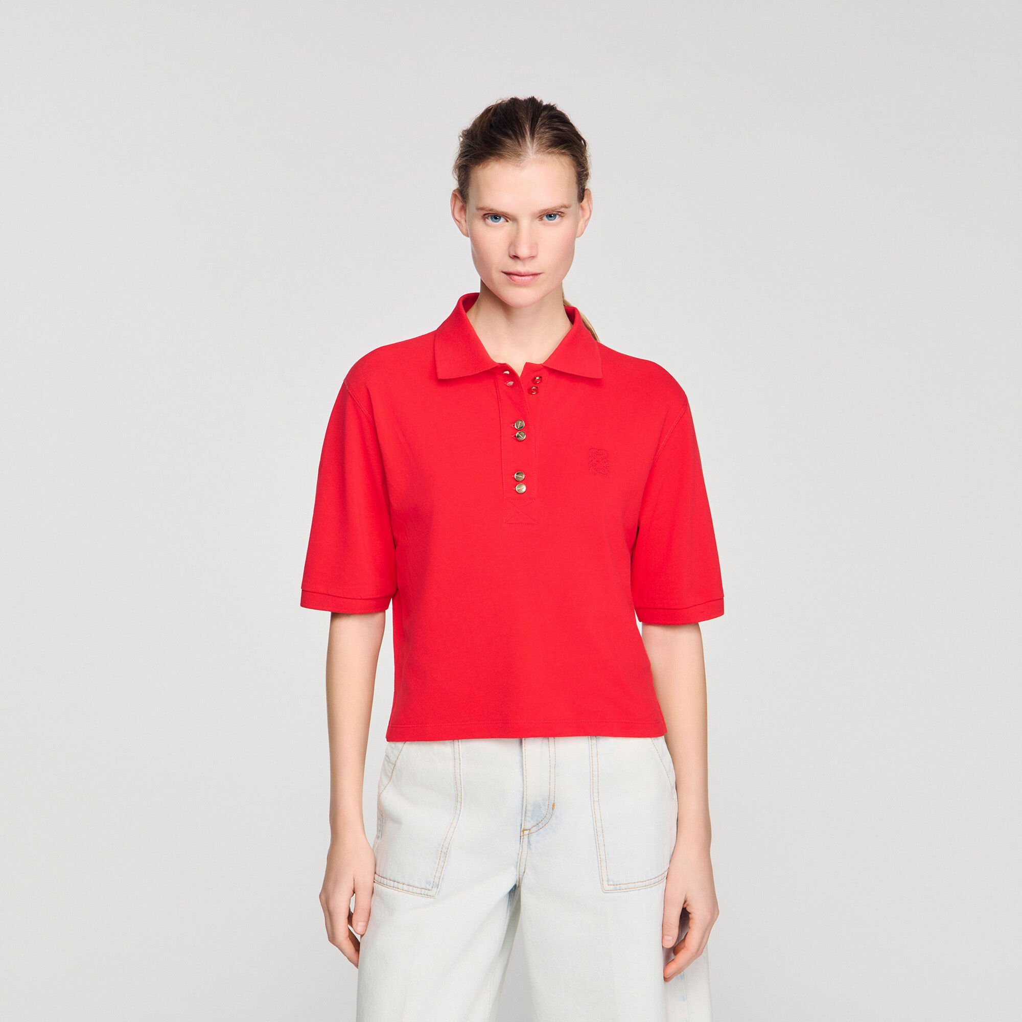Polo shirt with decorative buttons
