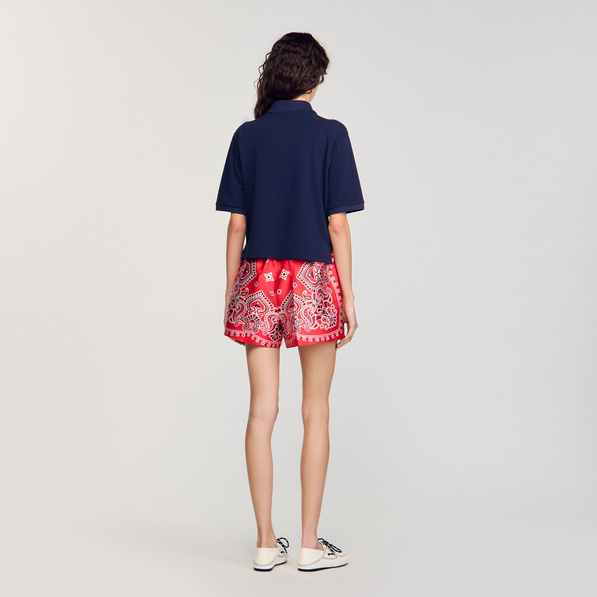 Polo shirt with decorative buttons