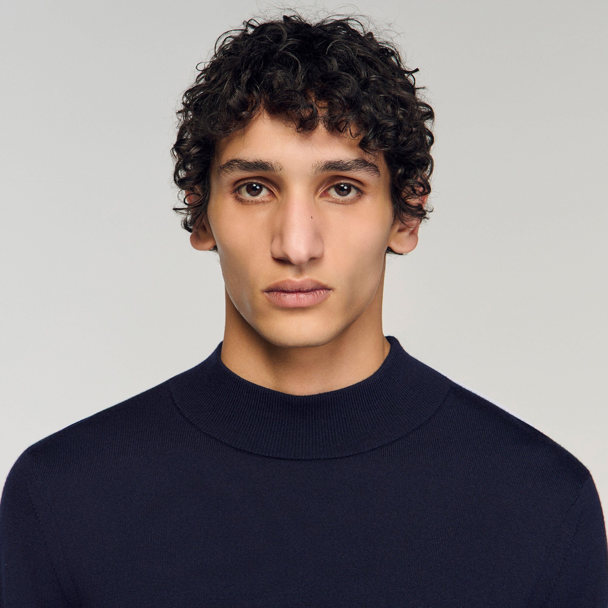 Wool jumper with a high collar