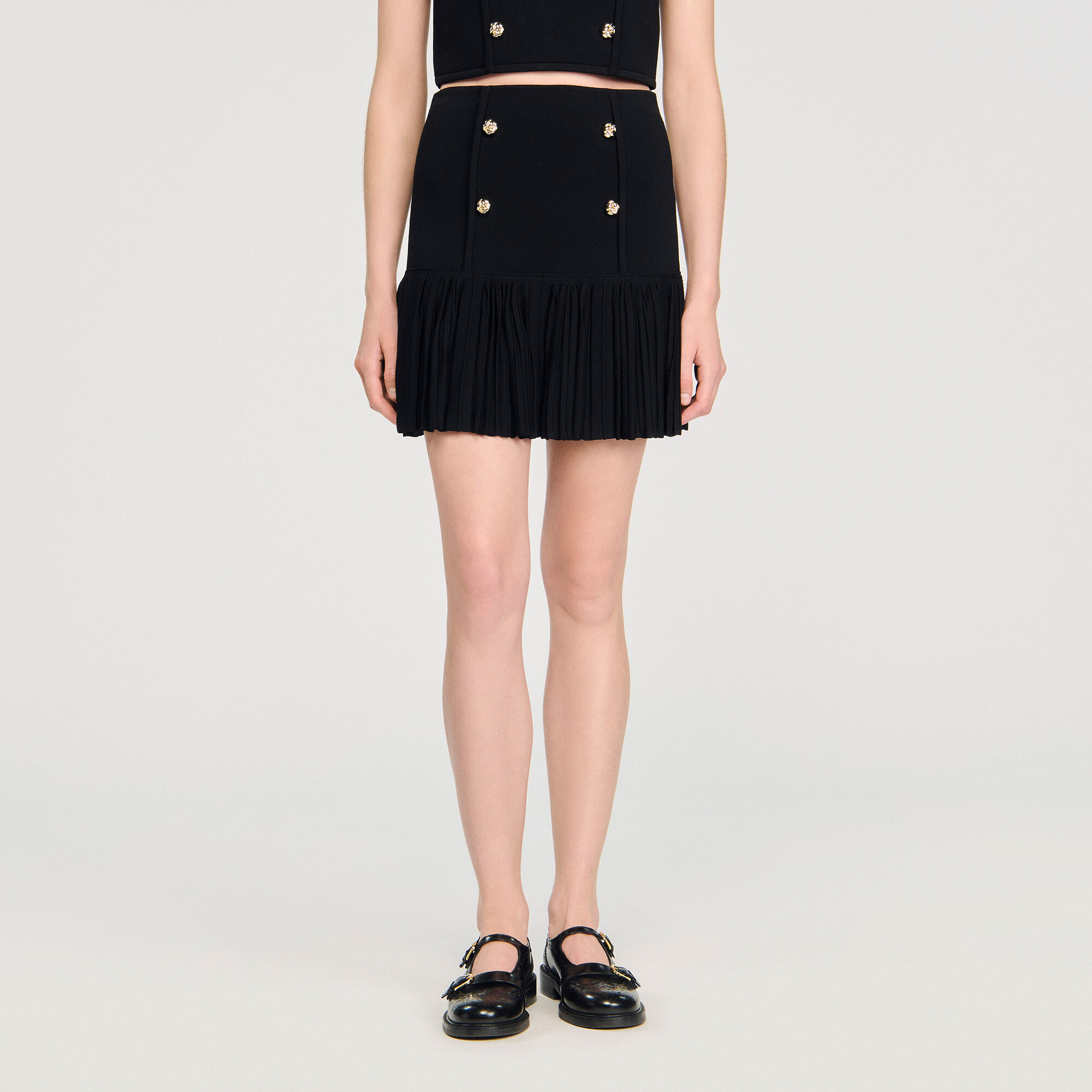 Short pleated knit skirt