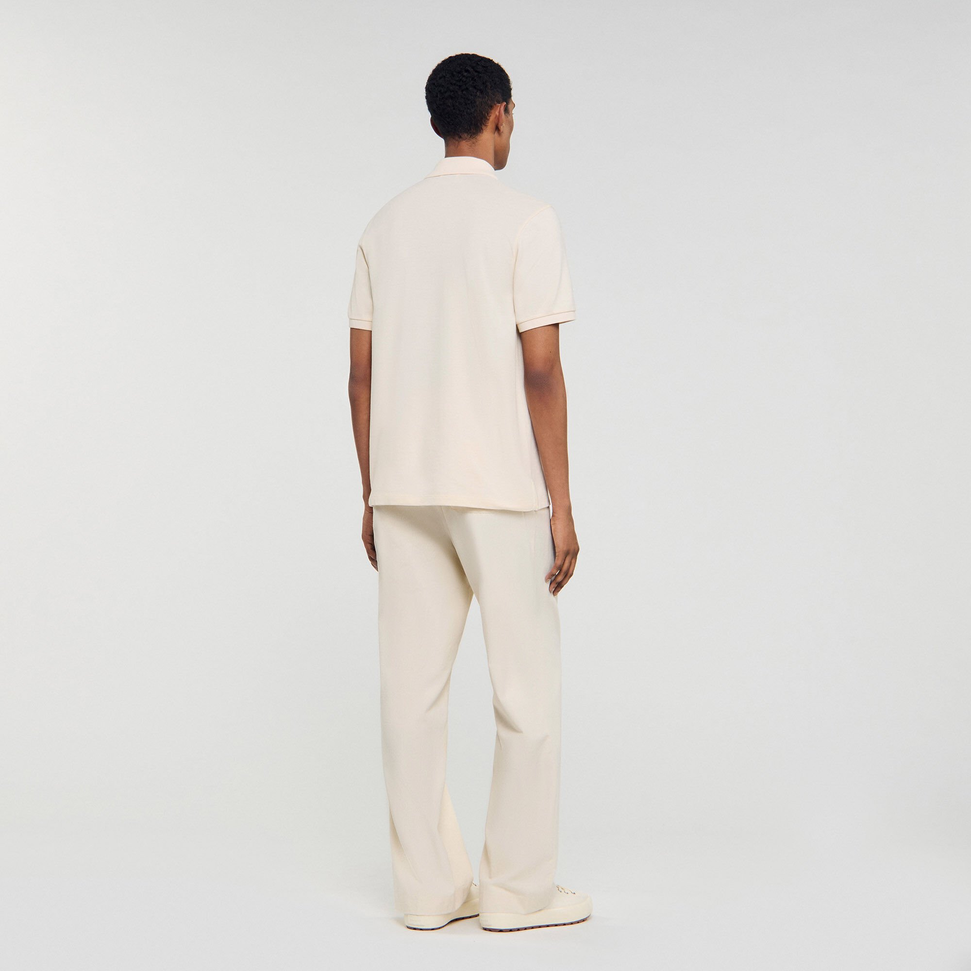 Polo shirt with leather logo white / beige for Men | Sandro