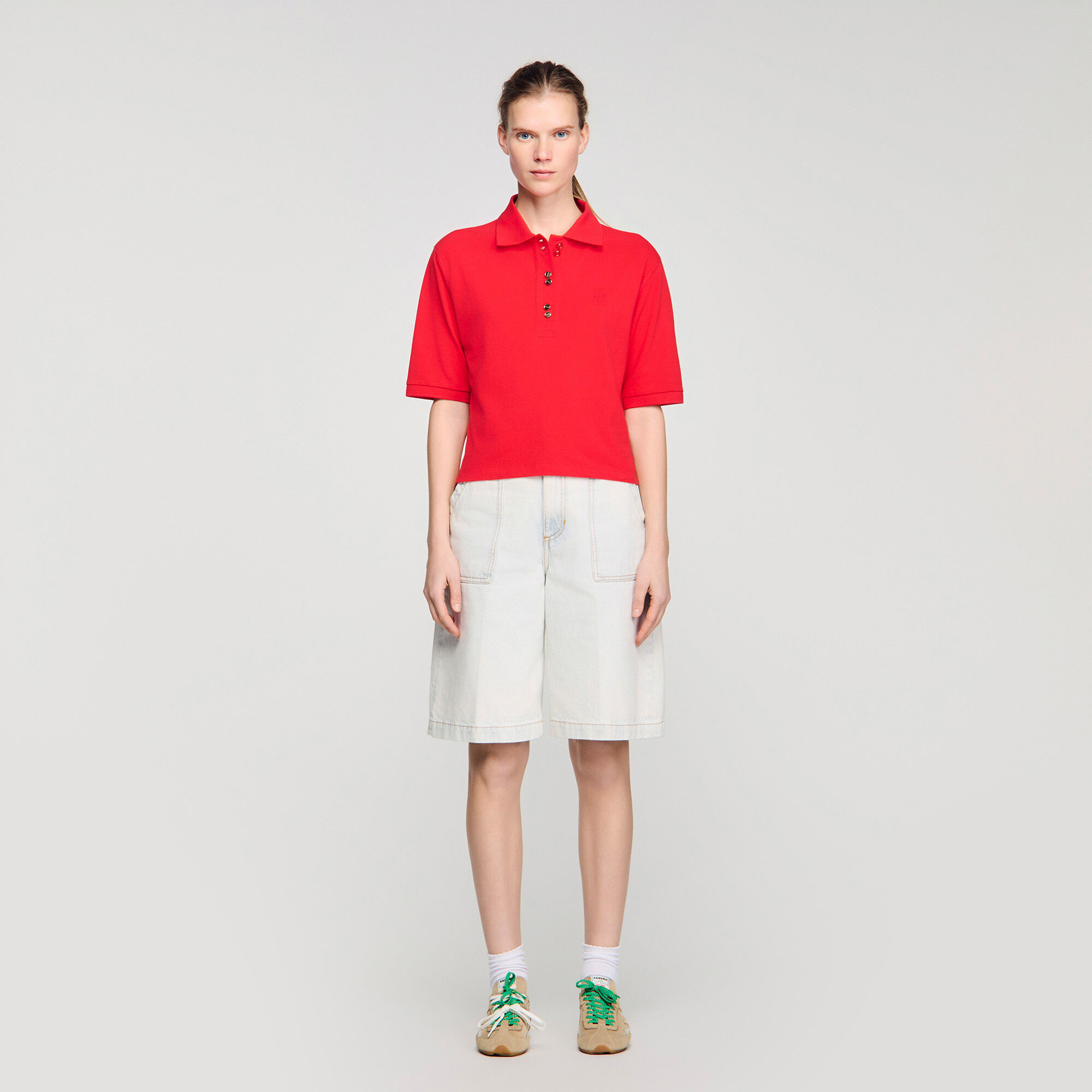 Polo shirt with decorative buttons