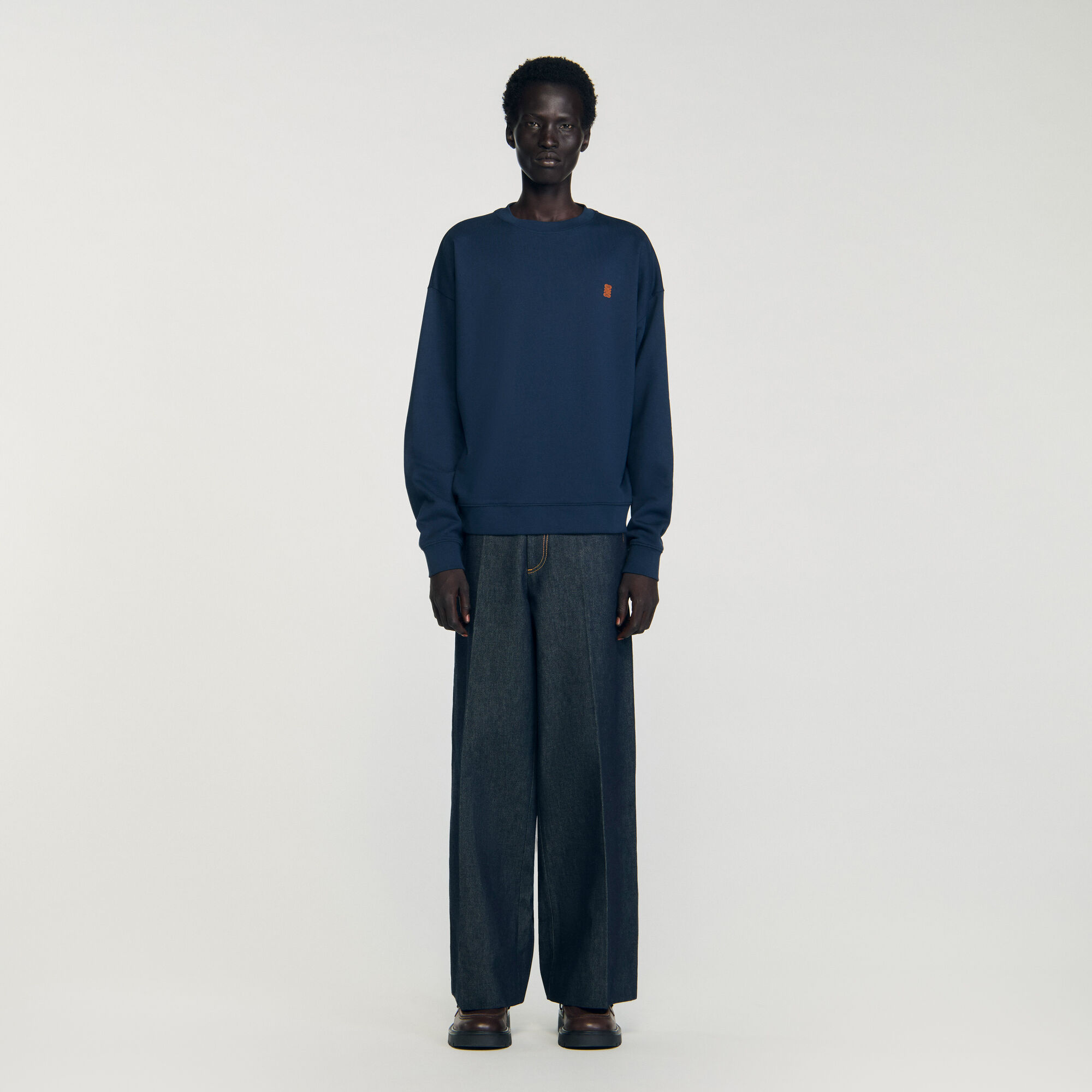 Oversized sweatshirt with leather patch