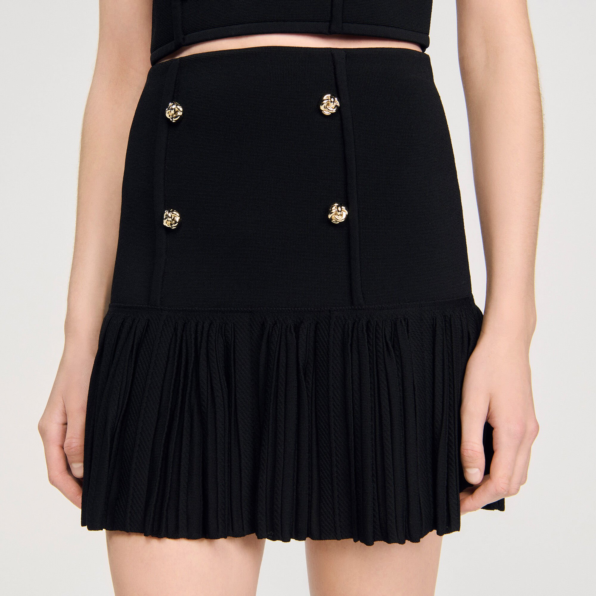 Short pleated knit skirt